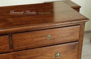 Reproduction of an antique chest of drawers handmade in planed and antiqued solid walnut wood